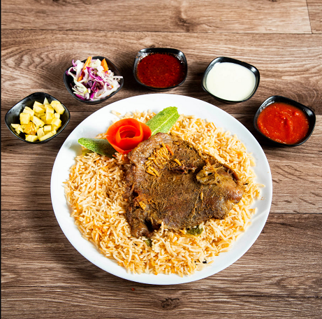 Arabian Mandi Dish Rice and Lamb with 5 signature sauces royal Arabian restaurant Dubai